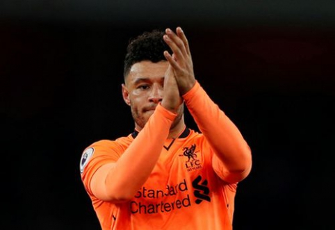 A. Oxlade-Chamberlain disappointed with himself, despite scoring a goal.