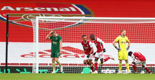 "Arsenal" and "Wolves" celebrate victories in England