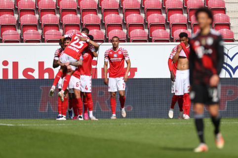 Mainz delayed Bayern's triumph in the Bundesliga championship.