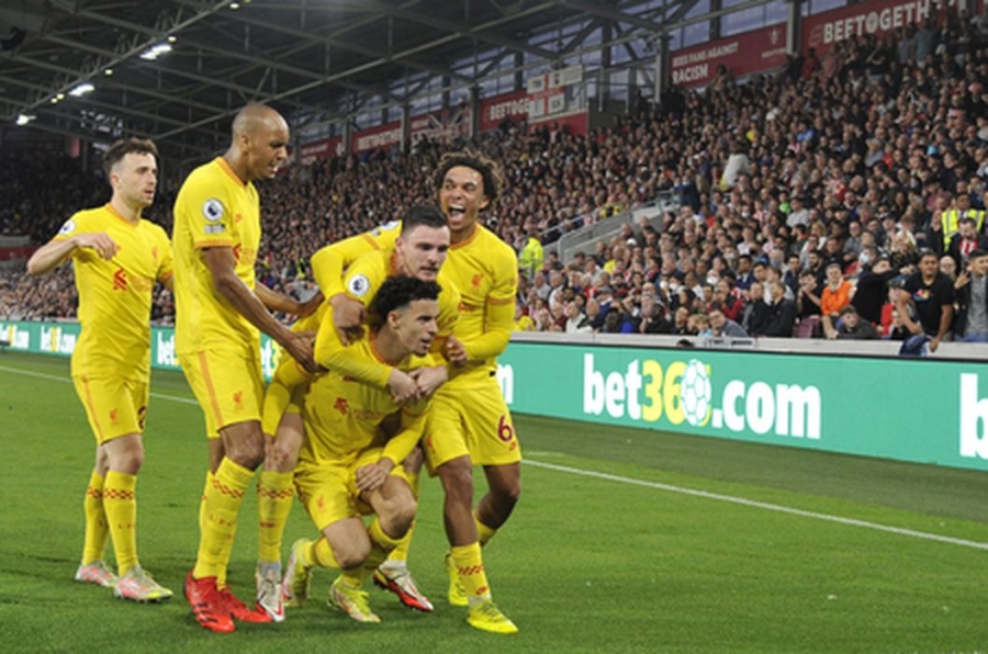 "Brentford" and "Liverpool" shared a point in the goal fest.