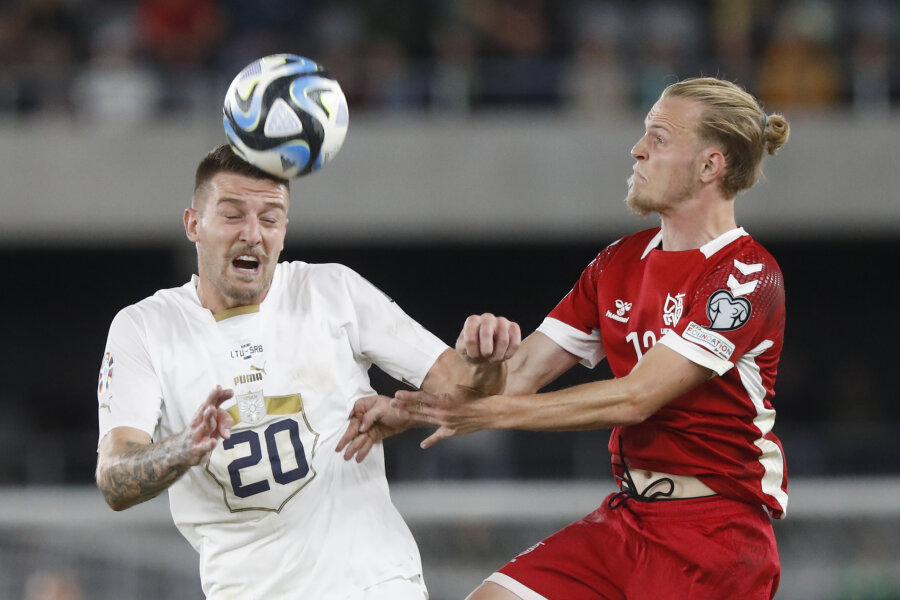 In friendly match, football players from Sweden and Serbia celebrate victory